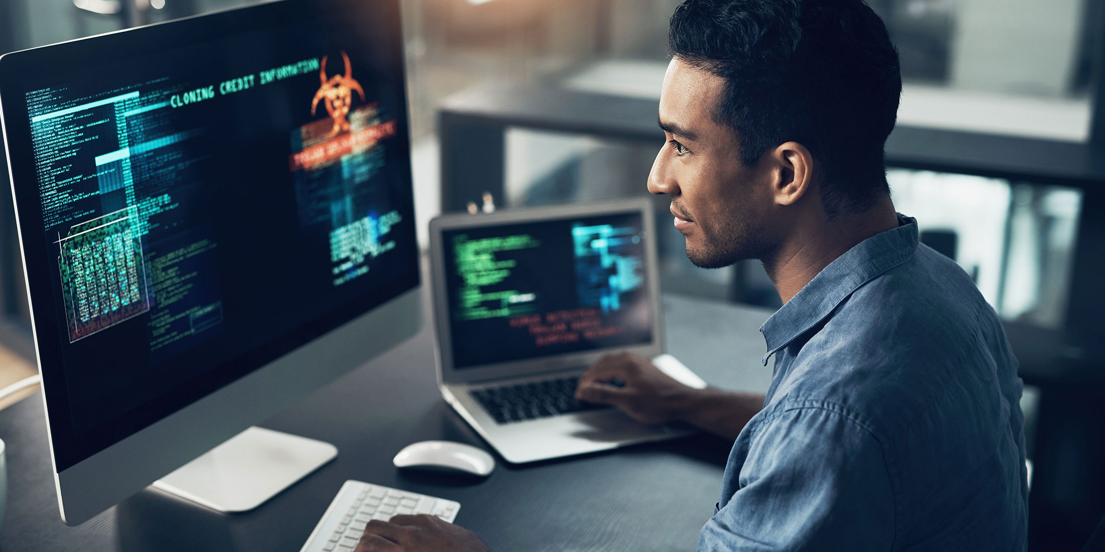 Man working on a laptop at his desk