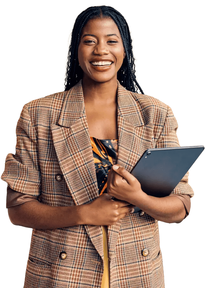 Young professional woman smiling and holding closed laptop under her arm.